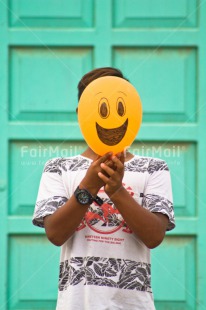 Fair Trade Photo Activity, Balloon, Birthday, Colour image, Colourful, Congratulations, Emotions, Face, Food and alimentation, Friendship, Fruits, Green, Happiness, Happy, One boy, One person, Orange, Outdoor, Party, People, Peru, Red, Smile, Smiling, South America, Vertical