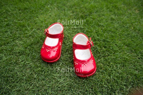 Fair Trade Photo Birth, Closeup, Colour image, Girl, Grass, Horizontal, New baby, People, Peru, Red, Shoe, Shooting style, South America