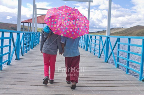 Fair Trade Photo Activity, Colour image, Day, Friendship, Horizontal, Outdoor, People, Peru, Rural, South America, Together, Two girls, Umbrella, Walking