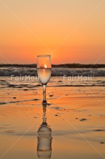 Fair Trade Photo Beach, Colour image, Food and alimentation, Fruits, Glass, Orange, Peru, Reflection, Sea, South America, Sunset, Vertical, Water