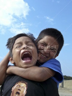Fair Trade Photo 10-15 years, Activity, Colour image, Day, Emotions, Friendship, Funny, Happiness, Latin, Looking at camera, Outdoor, People, Peru, Playing, Portrait halfbody, Seasons, Sky, Smile, Smiling, South America, Summer, Together, Two boys, Two children, Vertical