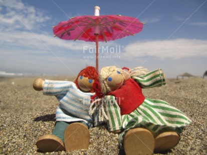 Fair Trade Photo Activity, Beach, Colour image, Focus on foreground, Friendship, Horizontal, Multi-coloured, Outdoor, Peru, Sand, Seasons, Sitting, South America, Summer, Tabletop, Together