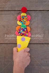 Fair Trade Photo Birthday, Blue, Body, Candy, Colour, Colour image, Emotions, Food and alimentation, Hand, Happy, Ice cream, Object, Party, Peru, Place, South America, Sweet, Vertical, Wood