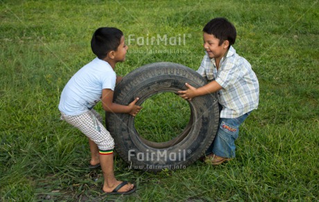 Fair Trade Photo Activity, Casual clothing, Clothing, Colour image, Cooperation, Day, Emotions, Friendship, Grass, Happiness, Horizontal, Outdoor, People, Peru, Playing, Rural, South America, Two boys