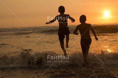 Fair Trade Photo Activity, Beach, Colour image, Friendship, Horizontal, People, Peru, Playing, Running, Sea, Shooting style, Silhouette, South America, Sunset, Two boys