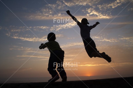 Fair Trade Photo Activity, Beach, Clouds, Emotions, Evening, Friendship, Group of boys, Happiness, Horizontal, Jumping, Light, Outdoor, People, Peru, Silhouette, Sky, South America