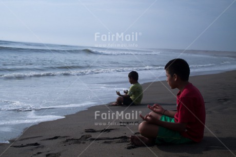 Fair Trade Photo 10-15 years, Activity, Backlit, Beach, Casual clothing, Clothing, Colour image, Evening, Friendship, Horizontal, Latin, Meditating, Outdoor, People, Peru, Sand, Sea, South America, Together, Two boys, Water, Yoga