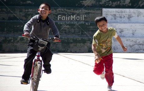 Fair Trade Photo 5 -10 years, Activity, Bicycle, Day, Friendship, Horizontal, Latin, Outdoor, People, Peru, Playing, Relaxing, Smiling, South America, Streetlife, Together, Transport, Two boys