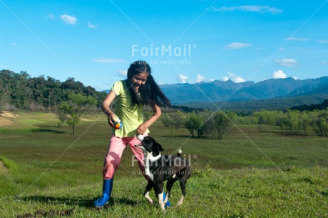Fair Trade Photo Activity, Animals, Ball, Colour image, Day, Dog, Emotions, Friendship, Happiness, Horizontal, Jumping, Mountain, One girl, Outdoor, People, Peru, Playing, Rural, Smiling, South America, Together