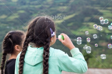 Fair Trade Photo Activity, Colour image, Dailylife, Emotions, Friendship, Happiness, Horizontal, Outdoor, People, Peru, Playing, Soapbubble, South America, Summer, Together, Two girls