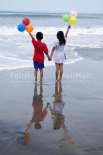 Fair Trade Photo Activity, Beach, Colour image, Cooperation, Emotions, Friendship, Happiness, Love, People, Peru, Playing, Sea, South America, Summer, Together, Two children, Vertical