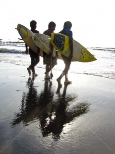 Fair Trade Photo Activity, Beach, Colour image, Evening, Friendship, Good luck, Group of boys, Outdoor, People, Peru, Reflection, Sea, South America, Sport, Surf, Surfboard, Vertical, Walking, Water