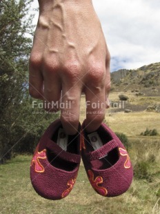 Fair Trade Photo Baby, Birth, Closeup, Colour image, Day, Hand, Nature, New baby, Outdoor, People, Peru, Shoe, South America, Vertical