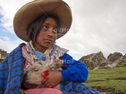 Fair Trade Photo 5 -10 years, Activity, Animals, Care, Clothing, Day, Ethnic-folklore, Horizontal, Latin, Looking away, One girl, Outdoor, People, Portrait halfbody, Rural, Sheep, Sombrero, Traditional clothing