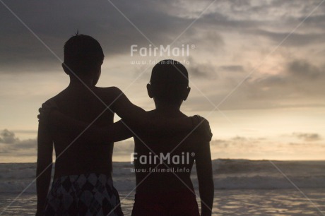 Fair Trade Photo Activity, Colour image, Emotions, Friendship, Happiness, Horizontal, Hugging, People, Peru, Sea, Shooting style, Silhouette, South America, Sunset, Two boys