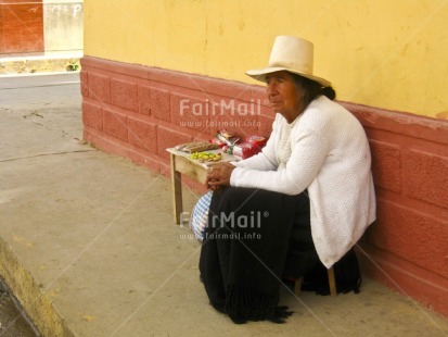 Fair Trade Photo 60-65 years, Activity, Clothing, Colour image, Day, Emancipation, Entrepreneurship, Hat, Horizontal, Latin, One woman, Outdoor, People, Peru, Selling, Sitting, Sombrero, South America, Street, Streetlife, Traditional clothing, White