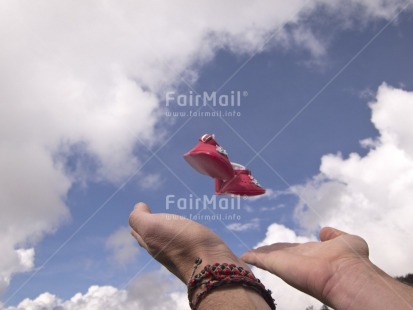 Fair Trade Photo Activity, Baby, Birth, Colour image, Flying, Focus on foreground, Hand, Horizontal, Multi-coloured, Outdoor, People, Peru, Shoe, South America, Tabletop