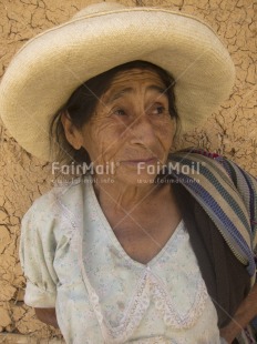 Fair Trade Photo 55-60 years, Activity, Clothing, Colour image, Day, Hat, Looking away, Old age, One woman, Outdoor, People, Peru, Portrait headshot, Rural, Sombrero, South America, Street, Streetlife, Vertical