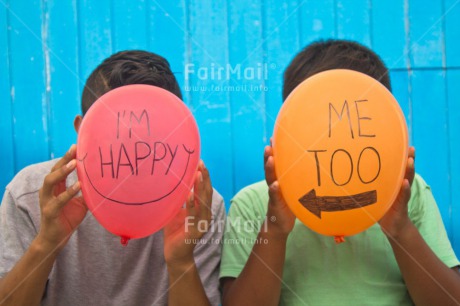 Fair Trade Photo Balloon, Blue, Colour image, Colourful, Emotions, Food and alimentation, Friendship, Fruits, Happiness, Happy, Horizontal, Letter, Orange, Outdoor, People, Peru, Red, Smile, South America, Text, Two, Two boys, Two people