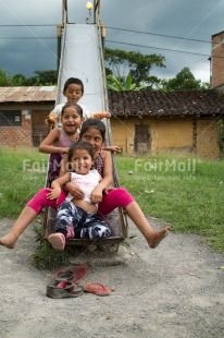 Fair Trade Photo Activity, Colour image, Day, Emotions, Friendship, Group of children, Happiness, Outdoor, People, Peru, Playground, Playing, Slide, Smiling, South America, Together, Vertical
