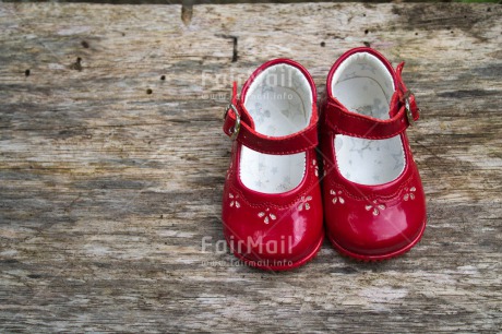 Fair Trade Photo Birth, Closeup, Colour image, Girl, Horizontal, New baby, People, Peru, Red, Shoe, Shooting style, South America, Wood
