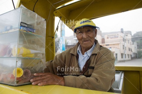 Fair Trade Photo 70-75 years, Activity, Casual clothing, Clothing, Colour image, Day, Food and alimentation, Horizontal, Ice cream, Latin, Looking at camera, Old age, Outdoor, People, Peru, Portrait halfbody, Selling, South America, Yellow