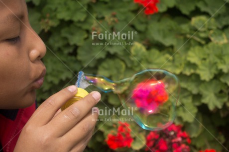 Fair Trade Photo Activity, Day, Horizontal, Latin, Looking away, One boy, Outdoor, People, Peru, Playing, Portrait headshot, Soapbubble, South America, Water