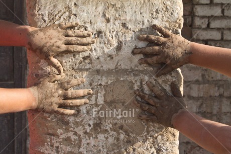 Fair Trade Photo Activity, Adobe brick, Closeup, Colour image, Construction, Friendship, Hand, Horizontal, People, Peru, Playing, Shooting style, South America, Two children