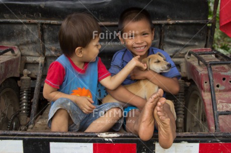 Fair Trade Photo Activity, Animals, Casual clothing, Clothing, Colour image, Dog, Friendship, Horizontal, Latin, People, Playing, Rural, Smiling, Streetlife, Two boys