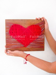 Fair Trade Photo Colour image, Crafts, Fathers day, Hands, Heart, Holding, Love, Mothers day, Peru, Red, South America, Valentines day, Vertical, Wood, Wool