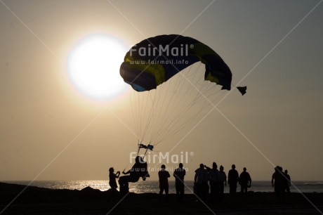Fair Trade Photo Colour image, Evening, Group of People, Horizontal, Outdoor, Parachute, Paragliding, People, Peru, Sea, Shooting style, Silhouette, South America, Sport, Sunset
