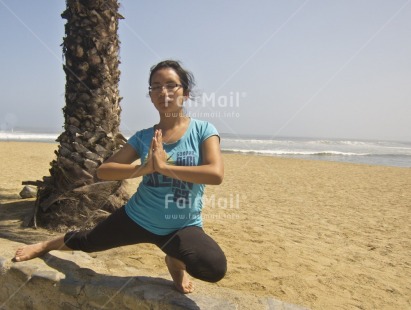 Fair Trade Photo 15-20 years, Activity, Beach, Casual clothing, Clothing, Colour image, Day, Horizontal, Latin, One girl, Outdoor, People, Peru, Sand, Seasons, South America, Summer, Tree, Wellness, Yoga