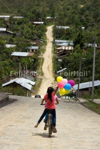Fair Trade Photo Balloon, Bicycle, Birthday, Colour image, Emotions, Happiness, Latin, One girl, Outdoor, People, Peru, Rural, South America, Transport, Vertical