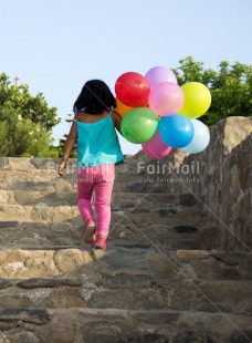 Fair Trade Photo Activity, Balloon, Birthday, Colour image, Confirmation, Day, Growth, One girl, Outdoor, Party, People, Peru, South America, Stairs, Summer, Vertical, Walking