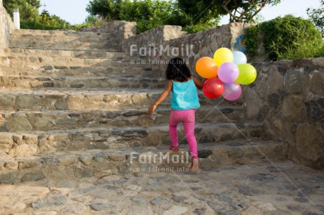 Fair Trade Photo Activity, Balloon, Birthday, Colour image, Confirmation, Day, Growth, Horizontal, One girl, Outdoor, Party, People, Peru, South America, Stairs, Summer, Walking