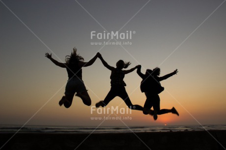 Fair Trade Photo Activity, Beach, Colour image, Evening, Friendship, Group of children, Horizontal, Jumping, People, Shooting style, Silhouette, Summer, Sunset