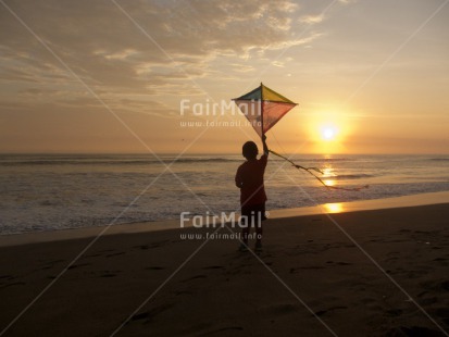 Fair Trade Photo Activity, Backlit, Beach, Colour image, Evening, Freedom, Kite, One boy, Outdoor, People, Peru, Playing, Sea, Silhouette, South America, Summer