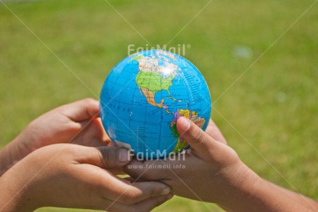 Fair Trade Photo Caring, Christmas, Closeup, Colour image, Cooperation, Environment, Globe, Hand, Horizontal, People, Peru, Sharing, Shooting style, South America, Sustainability, Together, Two children, Values, World