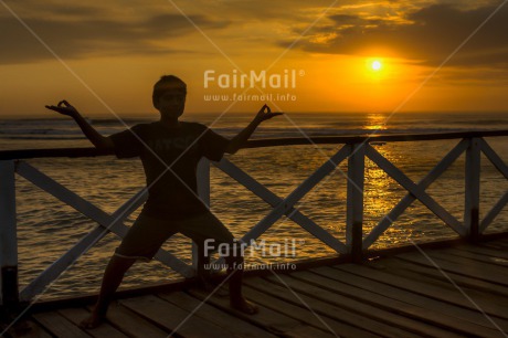 Fair Trade Photo Colour image, Horizontal, One boy, People, Shooting style, Silhouette, Sunset, Yoga