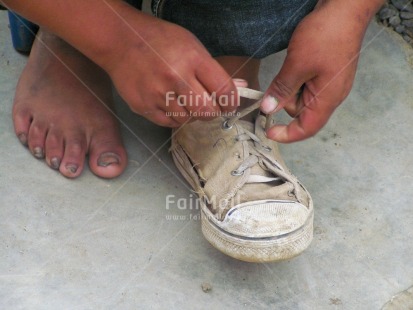 Fair Trade Photo Care, Colour image, Day, Education, Hand, Horizontal, One child, Outdoor, People, Peru, Shoe, South America, Street, Streetlife