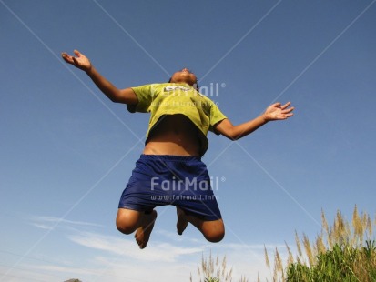 Fair Trade Photo 5-10 years, Activity, Blue, Colour image, Congratulations, Day, Emotions, Freedom, Happiness, Horizontal, Jumping, Latin, One boy, Outdoor, People, Peru, Portrait fullbody, Seasons, Sky, South America, Summer, Well done, Yellow