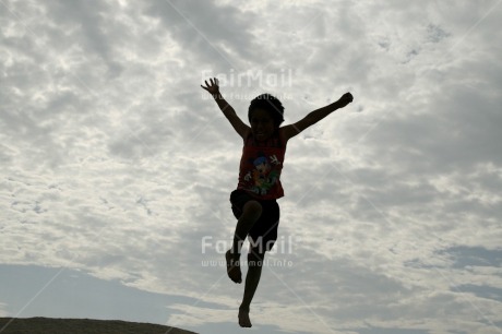 Fair Trade Photo Activity, Backlit, Clouds, Colour image, Emotions, Freedom, Happiness, Horizontal, Jumping, One boy, One child, People, Peru, Silhouette, Sky, South America