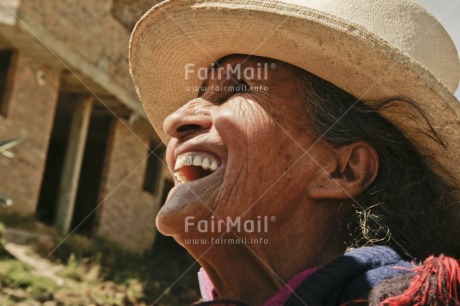 Fair Trade Photo 65-70 years, Activity, Colour image, Day, Emotions, Happiness, Hat, Horizontal, Latin, Looking away, Old age, One woman, Outdoor, People, Peru, Portrait headshot, Rural, Smiling, Sombrero, South America