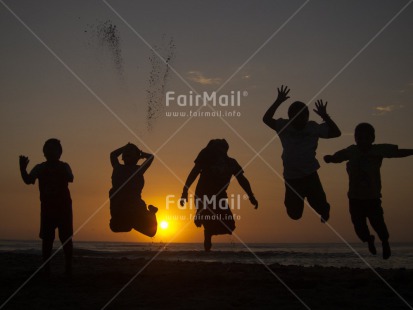 Fair Trade Photo Activity, Backlit, Beach, Colour image, Emotions, Evening, Friendship, Group of boys, Group of children, Happiness, Horizontal, Jumping, Outdoor, People, Peru, Sea, Silhouette, South America, Sunset, Water