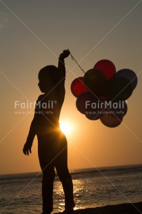Fair Trade Photo 5 -10 years, Activity, Balloon, Beach, Emotions, Evening, Happiness, One boy, Outdoor, People, Peru, Playing, South America, Sunset, Vertical