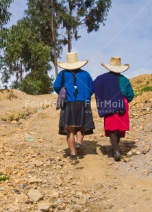 Fair Trade Photo Activity, Colour image, Day, Friendship, Latin, Looking away, Outdoor, People, Peru, Portrait fullbody, Rural, Sombrero, South America, Two women, Vertical, Walking