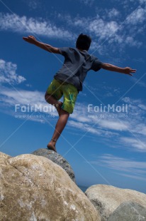 Fair Trade Photo 10-15 years, Colour image, Low angle view, One boy, Outdoor, People, Peru, Sky, South America, Stone, Vertical, Yoga