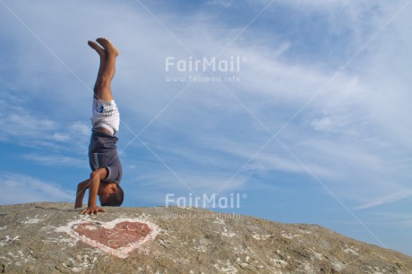 Fair Trade Photo 10-15 years, Activity, Colour image, Doing handstand, Heart, Horizontal, One boy, Outdoor, People, Peru, South America, Yoga
