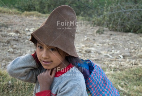 Fair Trade Photo 5 -10 years, Activity, Clothing, Colour image, Ethnic-folklore, Horizontal, Latin, Looking away, One girl, Outdoor, People, Peru, Rural, Smiling, South America, Traditional clothing