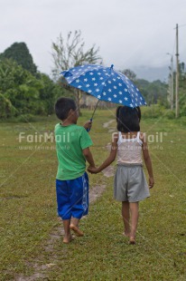 Fair Trade Photo Activity, Colour image, Cute, Friendship, Grass, Horizontal, People, Peru, Rural, South America, Together, Two children, Umbrella, Vertical, Walking